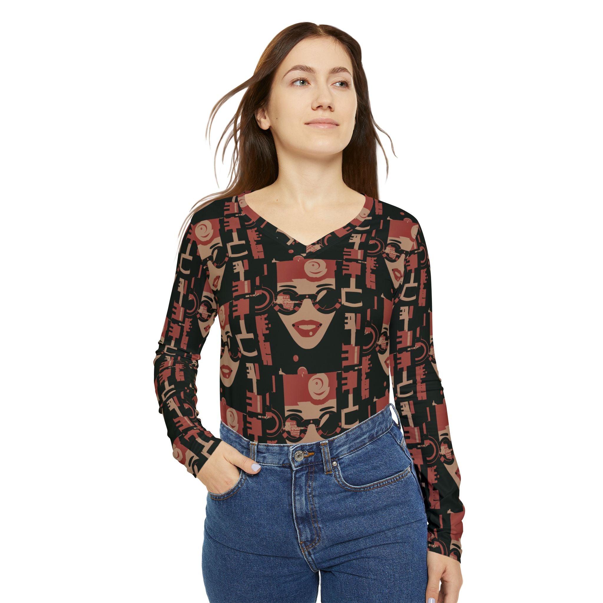 Women's V-neck long sleeve top with repeating face print, dark base.