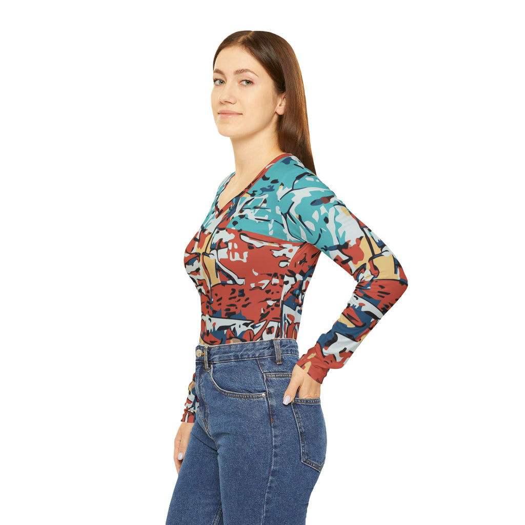 Side view of women’s V-neck long-sleeve abstract coastal print top in teal and red