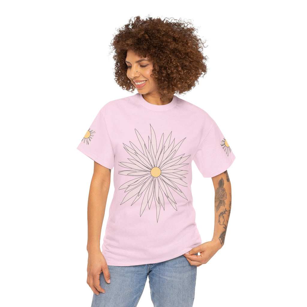 Light pink graphic tee on model with large daisy flower front print and small sleeve daisies.