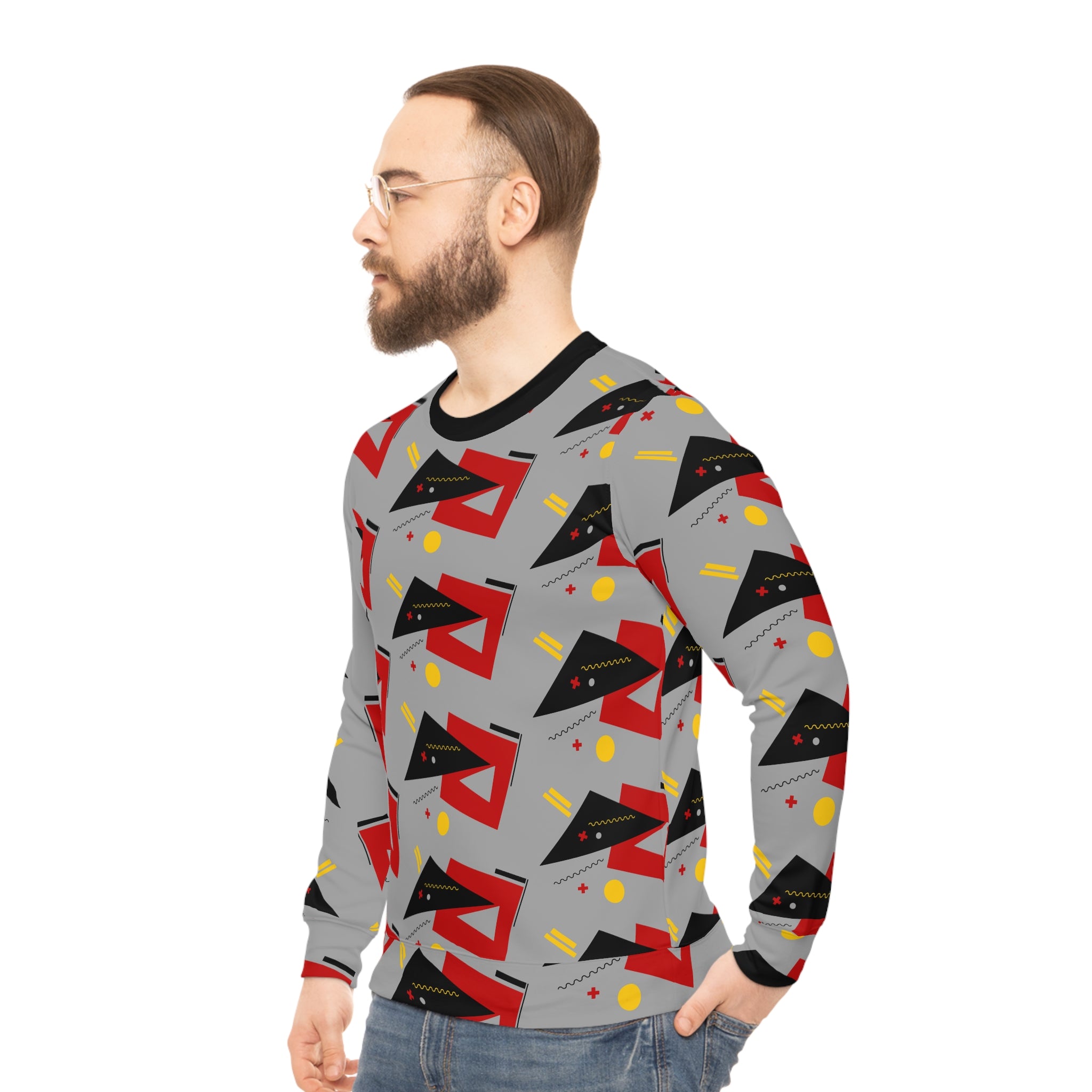 Gray crewneck sweatshirt with red and black geometric print, side view on model.