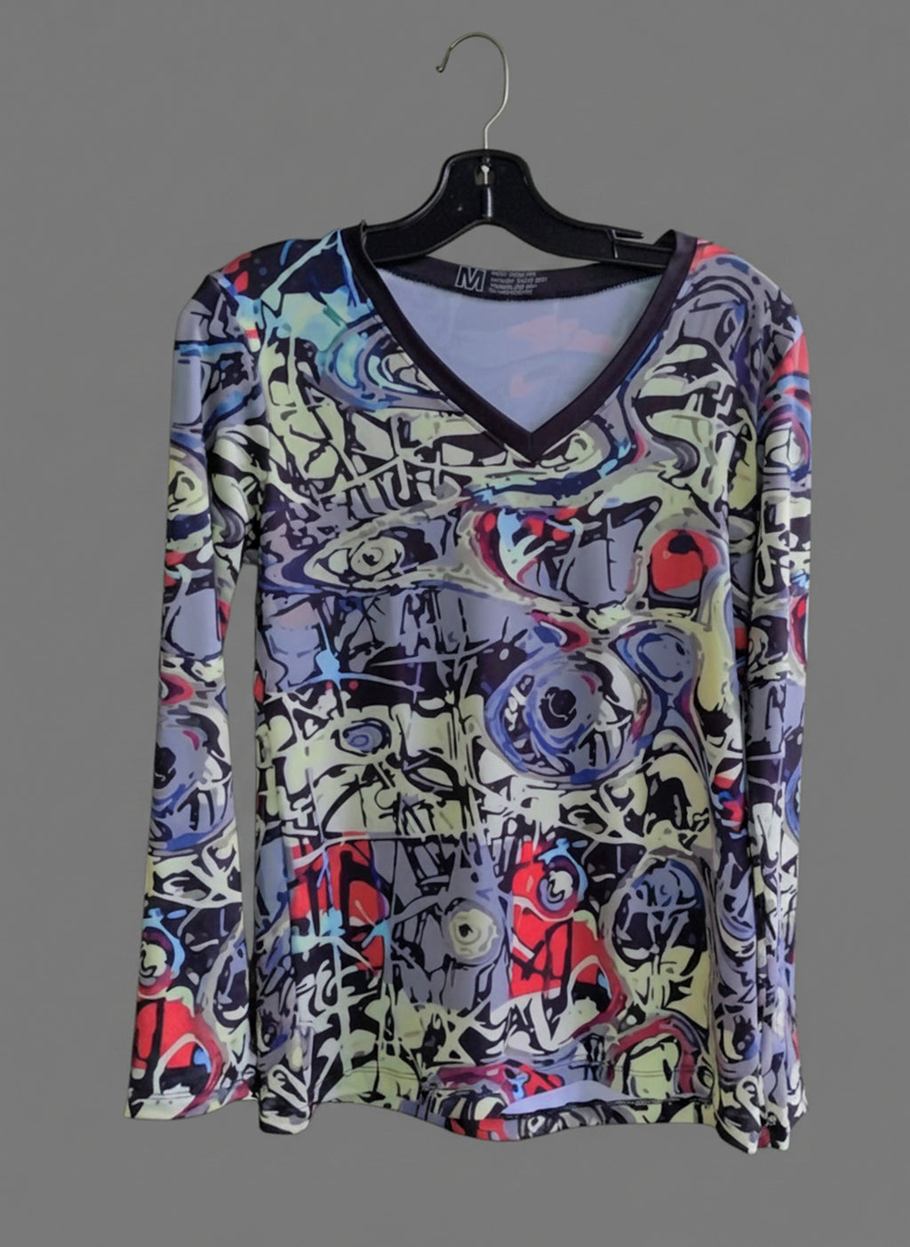 Graffiti V-neck long-sleeve shirt on hanger, light base with multicolor abstract print