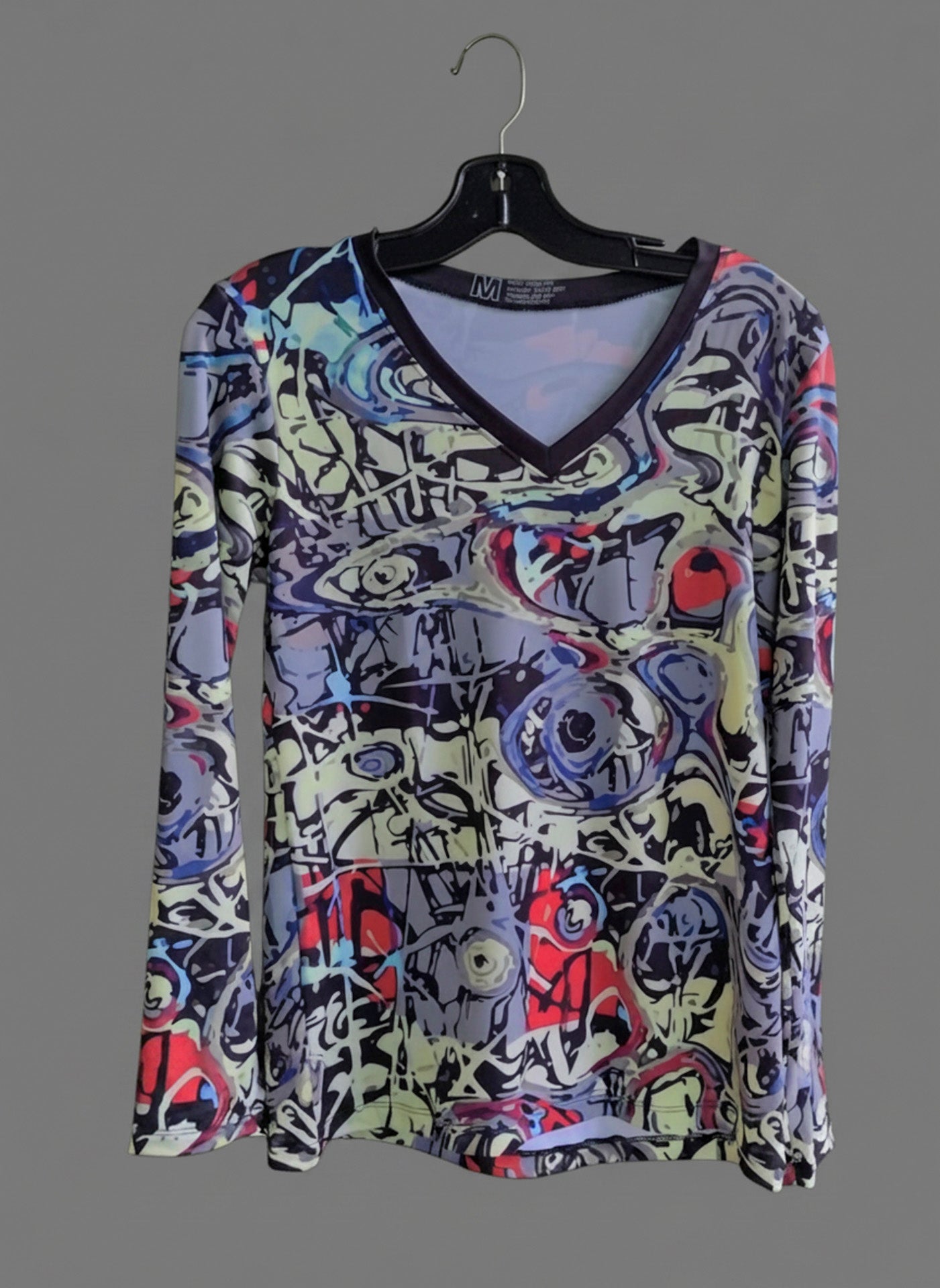 Graffiti V-neck long-sleeve shirt on hanger, light base with multicolor abstract print