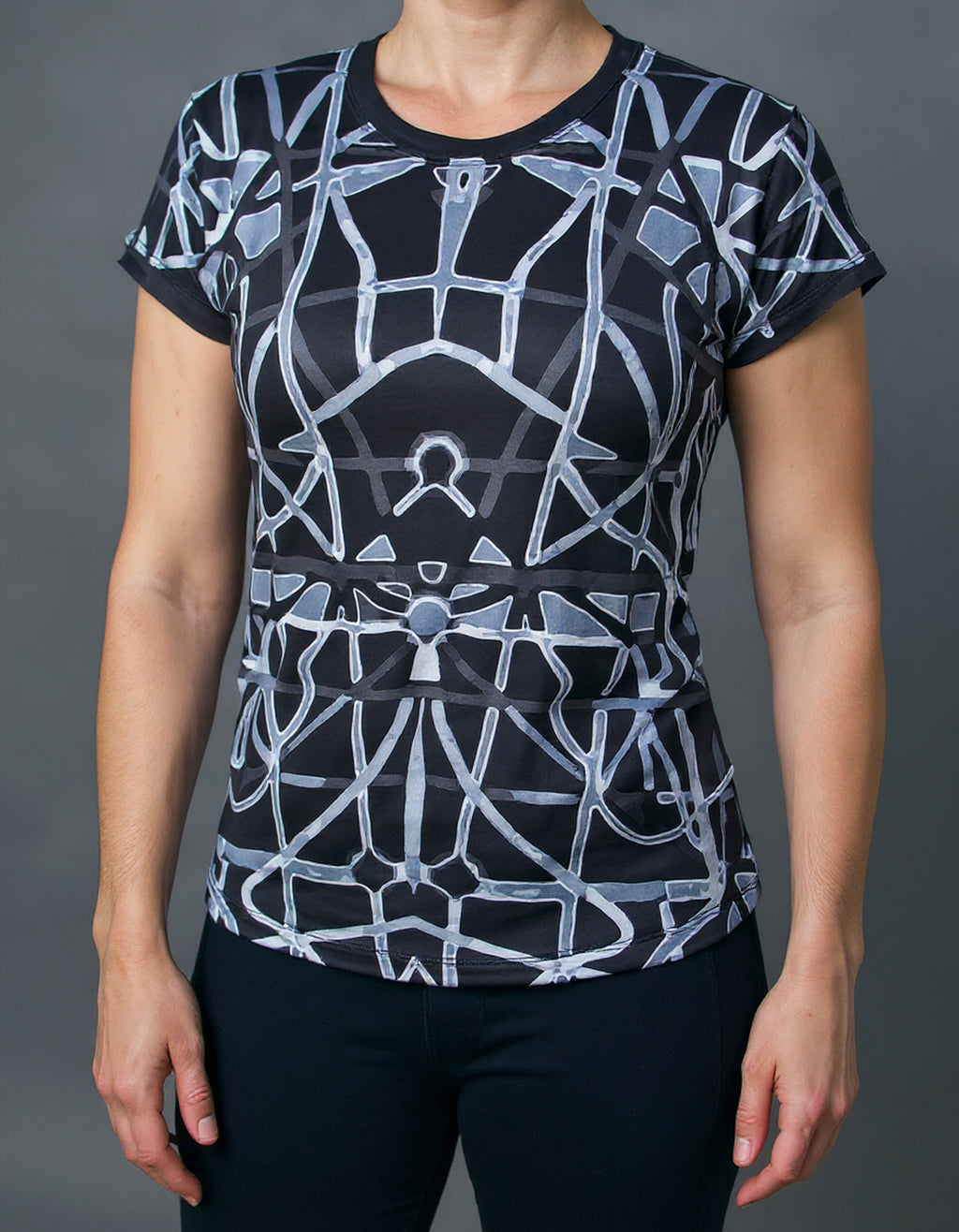 Women's short sleeve shirt on model, black with gray abstract geometric all-over print