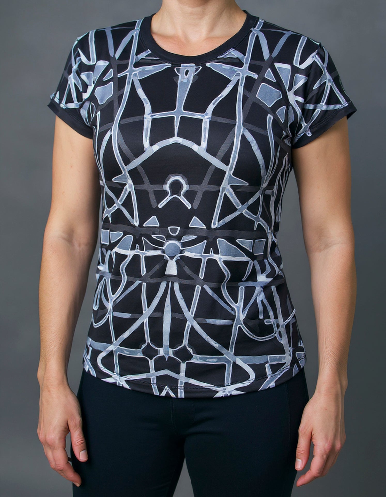 Women's short sleeve shirt on model, black with gray abstract geometric all-over print