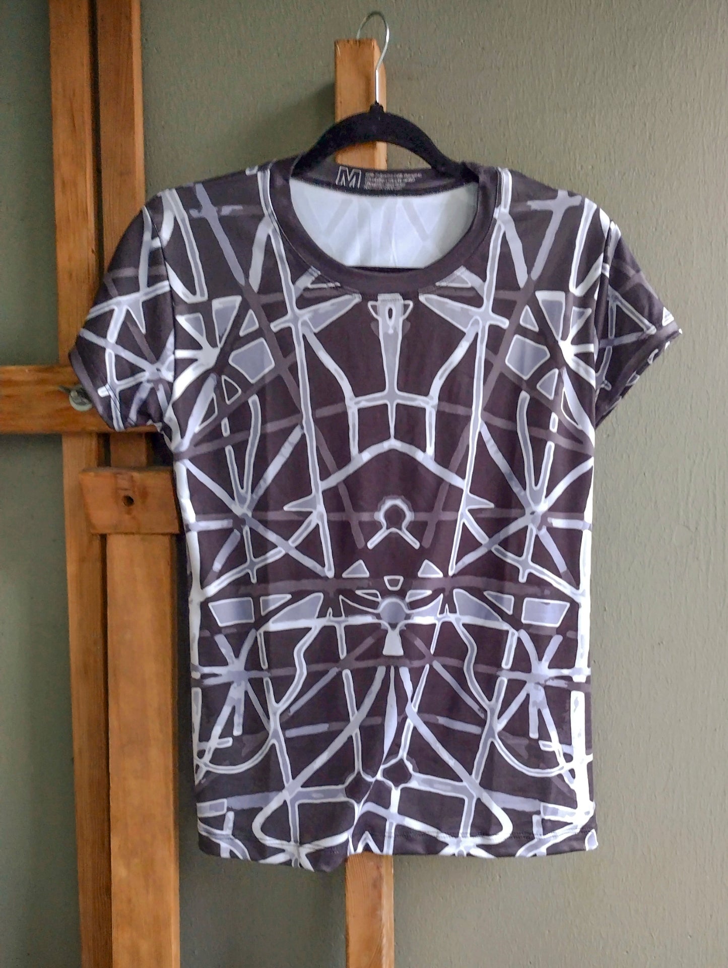 Women's short sleeve shirt on hanger, black with gray abstract geometric all-over print