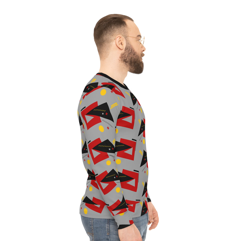 Gray geometric sweatshirt with red blocks and yellow dots, side profile.