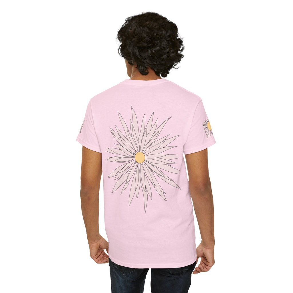 Light pink graphic tee with large daisy outline and yellow center; small flower on sleeve
