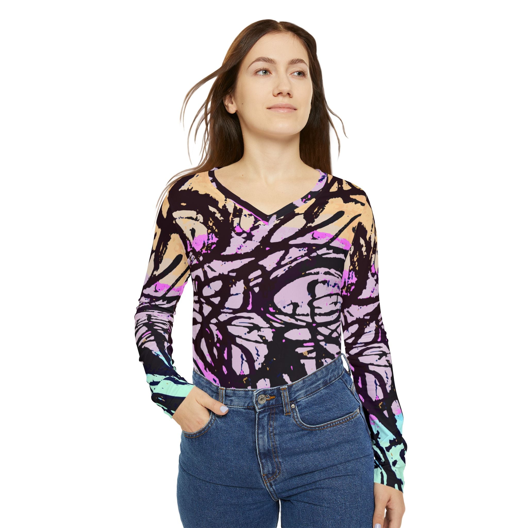 Women’s abstract v-neck long-sleeve shirt in purple, beige, and teal shown with jeans