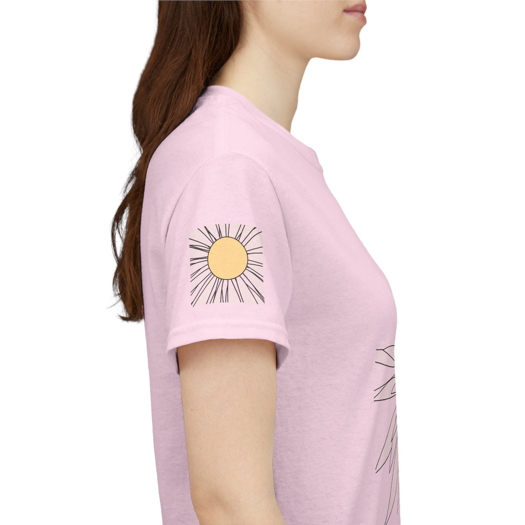Light pink tee side view with large back daisy flower print on the shoulder