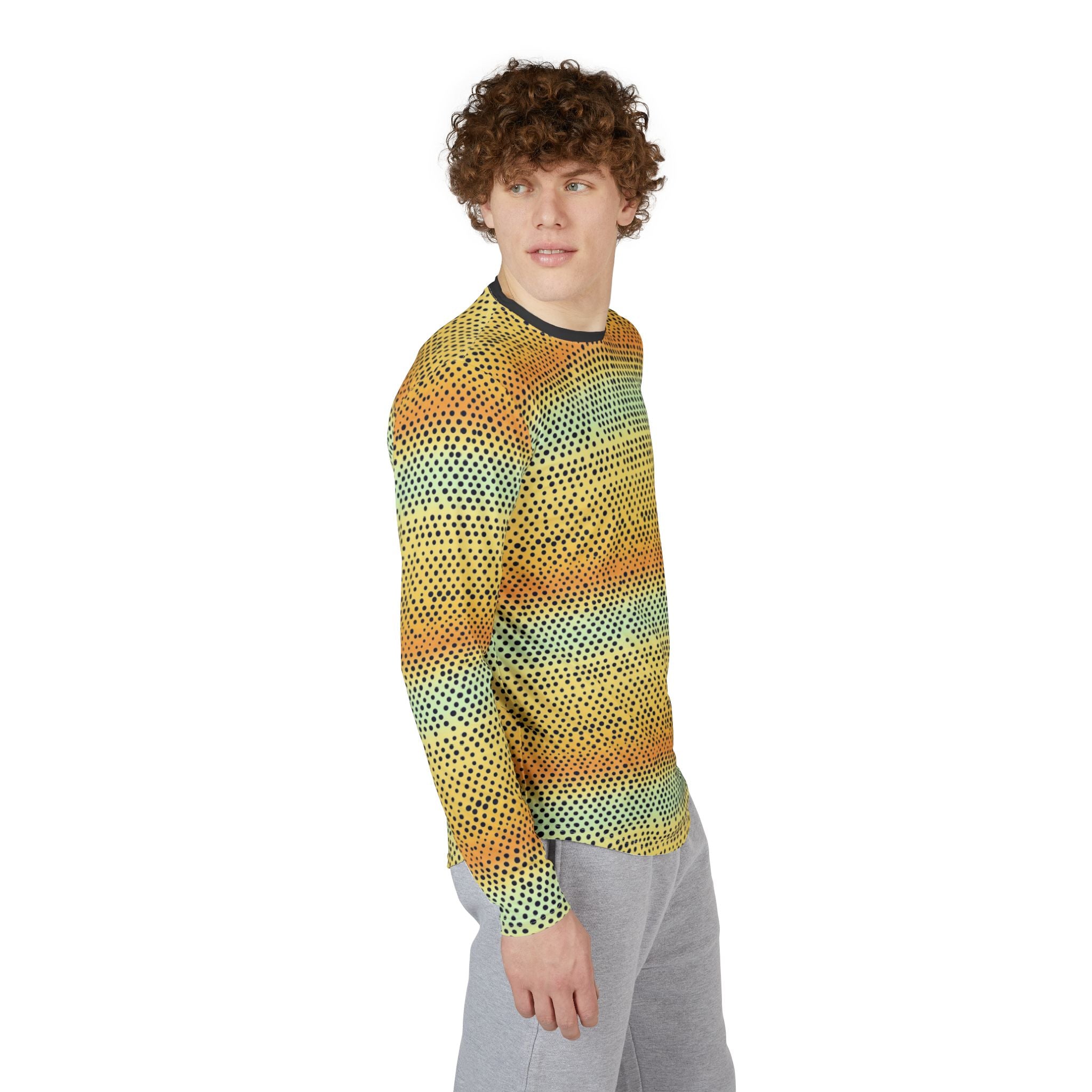 Long-sleeve crew shirt on model angled view: yellow with teal dotted gradient, dark trim
