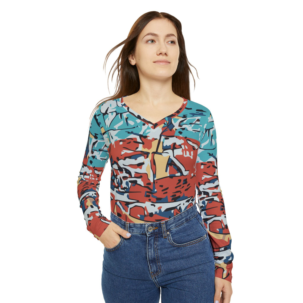 Front view of women’s V-neck long-sleeve abstract coastal print top with teal and red