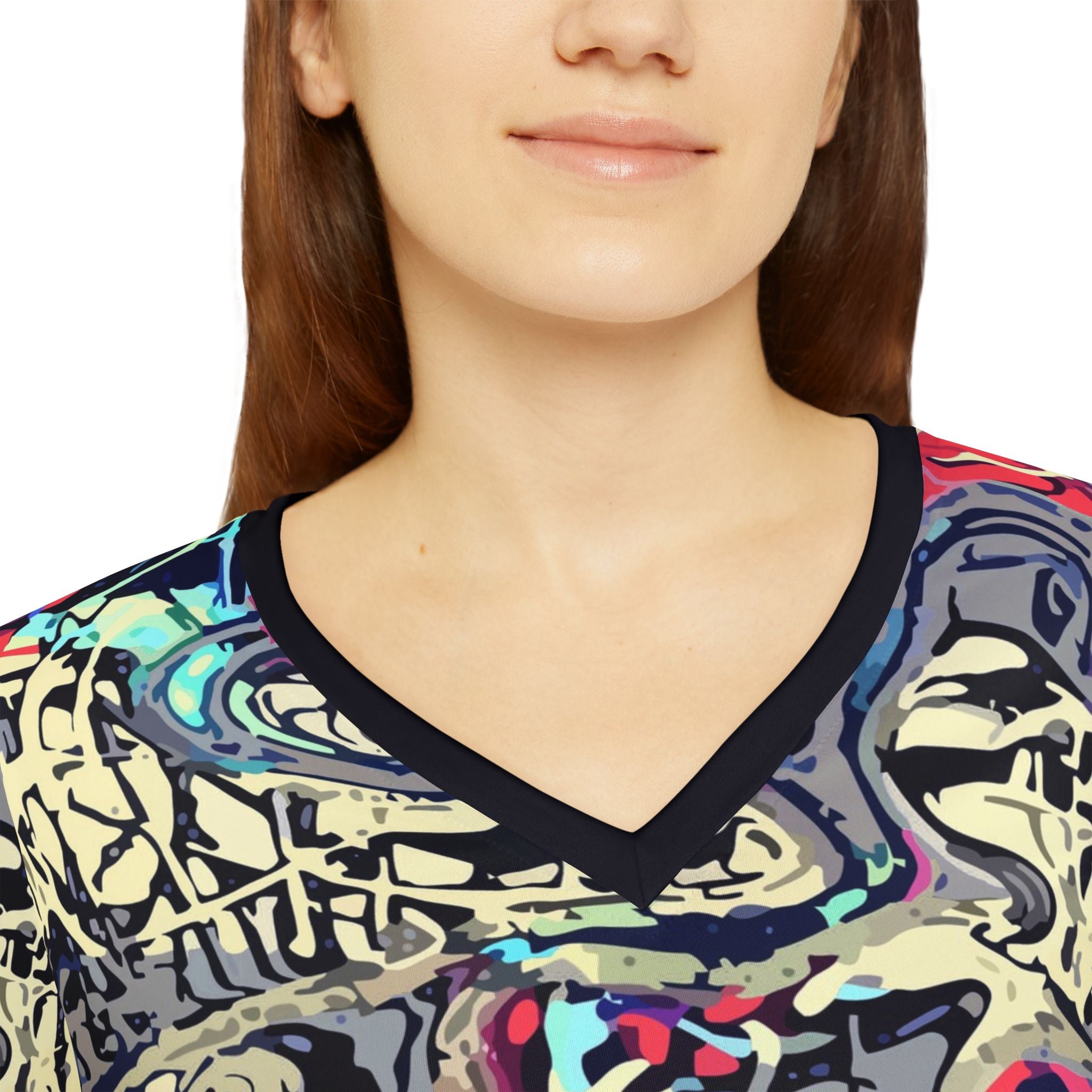 Close-up of abstract graffiti print v-neck long-sleeve shirt with dark edge trim.