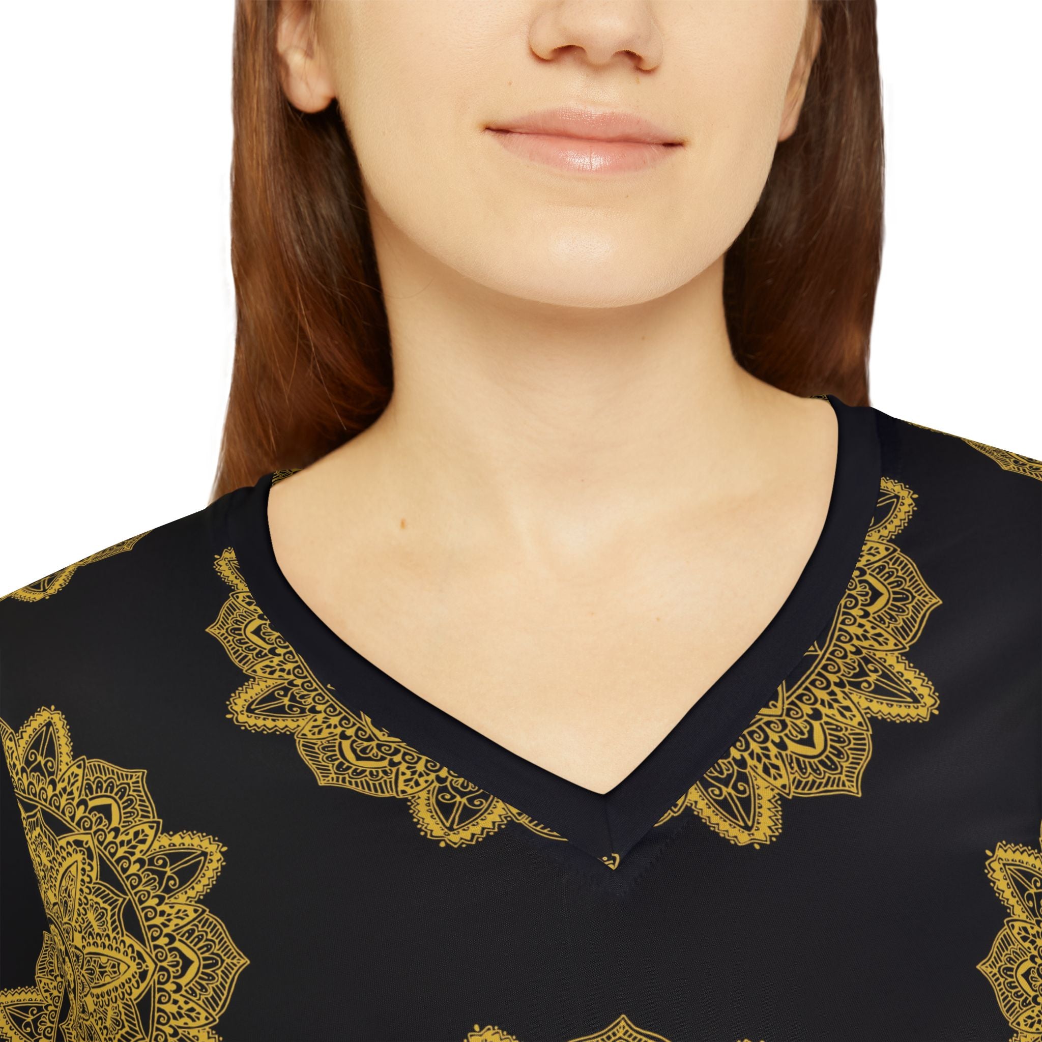 V-neck long sleeve shirt with gold mandala print around the neckline on dark fabric